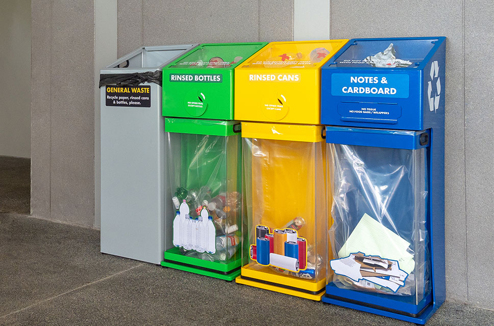 The Recycle Right bins feature a transparent bin body, a display of unacceptable items and a smaller, slidable opening to nudge people to recycle correctly.